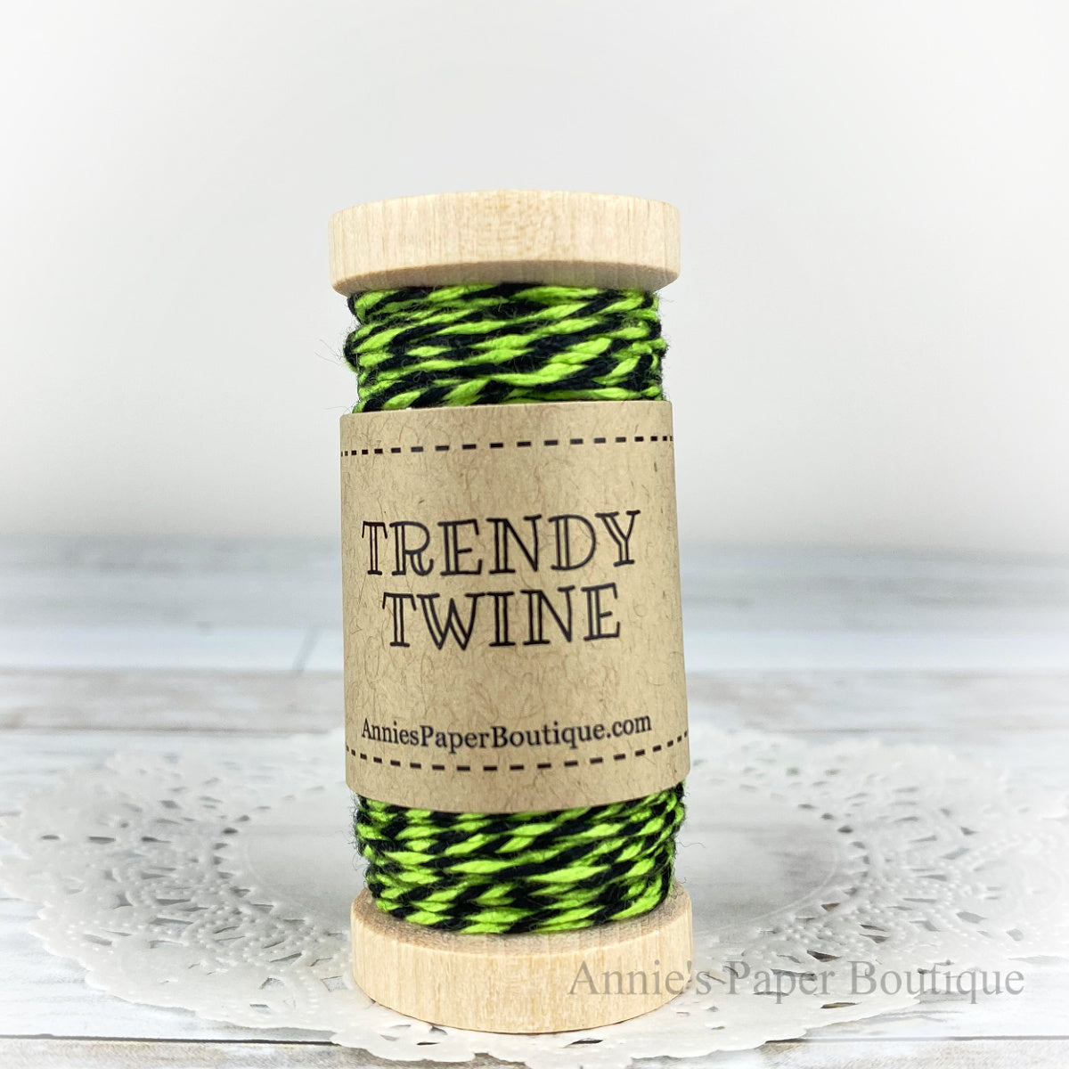 Lime Licorice Trendy Twine. Lime and black string on a wooden spool.