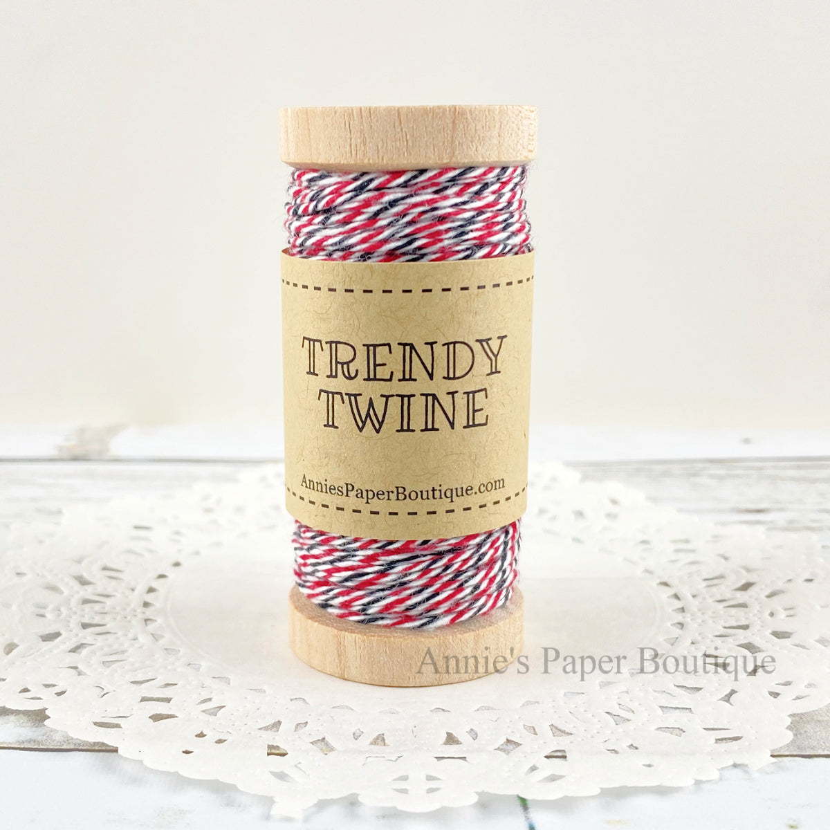 Cherry Midnight Petite Trendy Twine. Red, white, and black twine on a wooden spool.