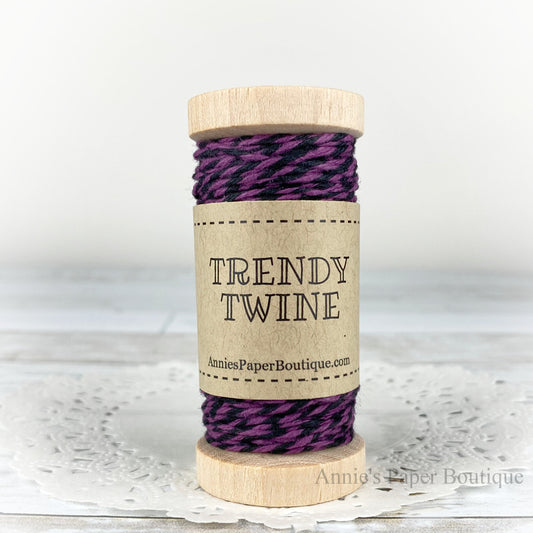 Grape Licorice Petite Trendy Twine. Purple and black string on a wooden spool.